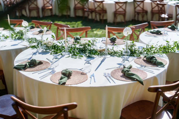 istock Dining tables decorated with flowers for a rustic wedding reception 2166246369