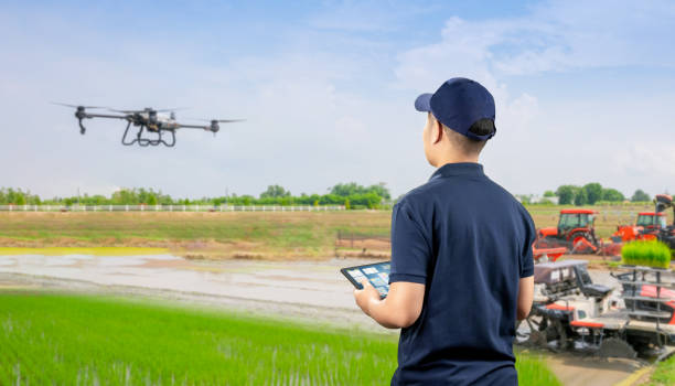 istock Agriculture technology with agricultural engineer work with drone fly above 2166246595