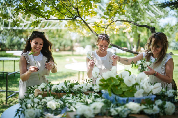 The wedding planning team is preparing the floral garlands