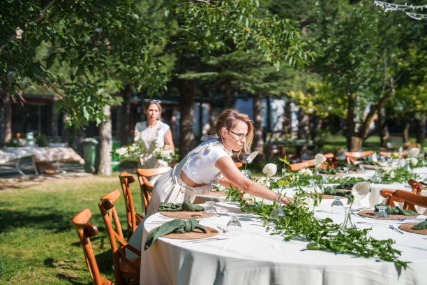 Moments of the team working on floral decorations for a wedding event.