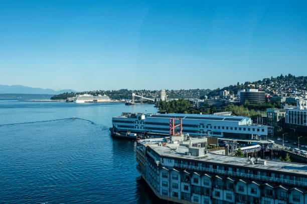 Seattle, WA - July 7, 2024: The Majestic Princess docked at Pier 91 in Seattle viewed from a ship docked at Pier 66 with a portion of the Edgewater hotel in the foreground.