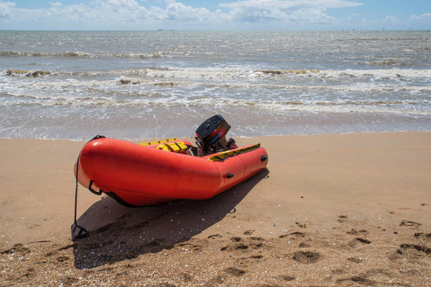 istock Red boat on the beach 2166266613