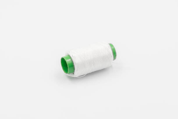 Colorful Spool of sewing thread, spool of industrial threads, Colored spools of thread on a white background.