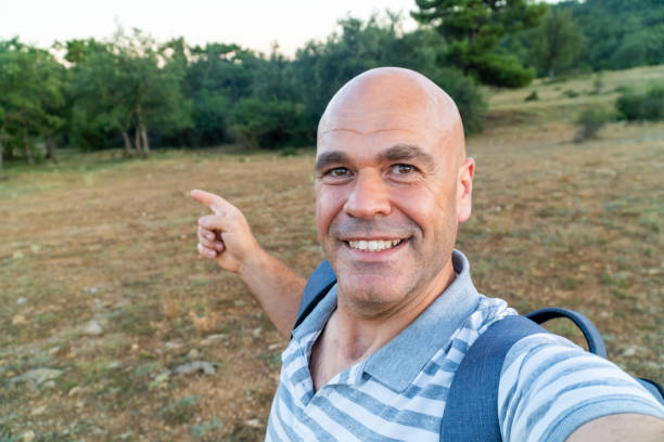 istock Man takes a selfie outdoors 2166272561