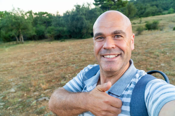 istock Man takes a selfie outdoors 2166272563
