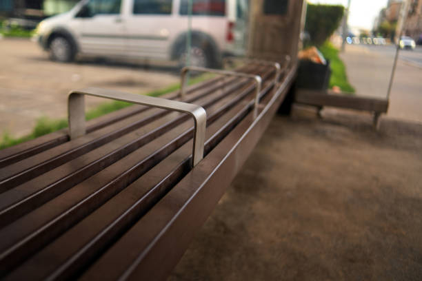 istock bench features metallic ribs, designed to deter sleeping and loitering. A reflection of societal efforts to create safe public spaces, it emphasizes functionality over comfort 2166272900