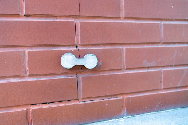 istock external concrete overlay applied to a cracked brick wall, representing a practical repair solution to enhance structural integrity and aesthetic appeal 2166272901