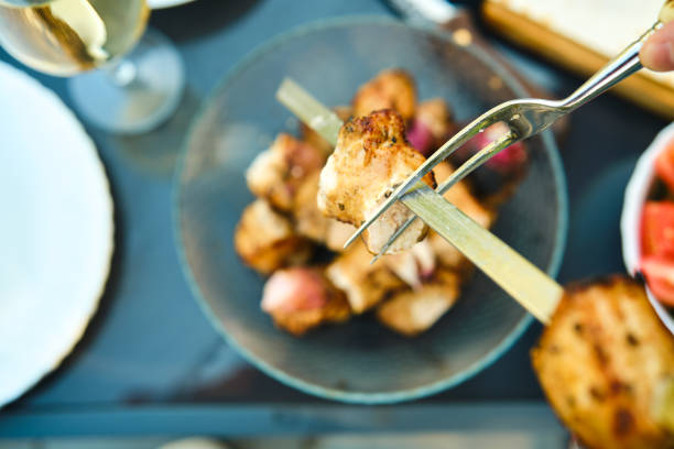 Grilling sausage on skewer. street food