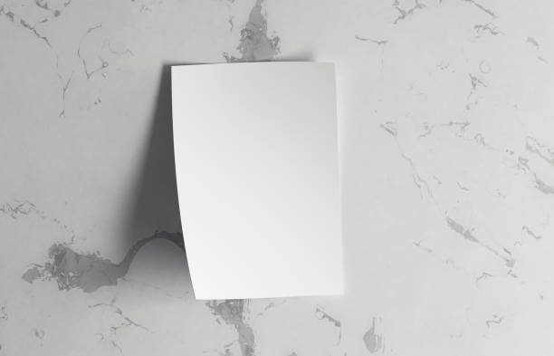 istock White blank poster mockup hanging on the marble wall 2166278733