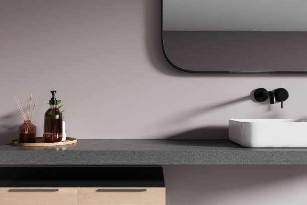 istock Grey home bathroom interior with sink and stone counter, accessories 2166279502