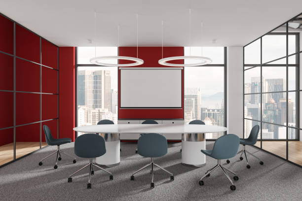 istock Modern conference room with a large table and chairs, panoramic windows, and red accent walls. Light, urban office space for business meetings. 3D Rendering 2166279589