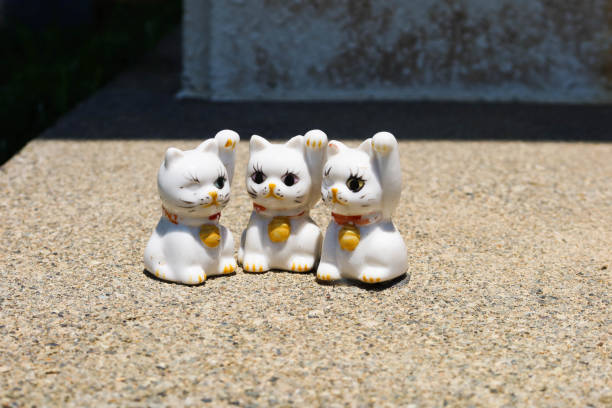 Daiosaki Lighthouse, Mie, Japan- 20 Jul 2024: three pottery maneki neko cat