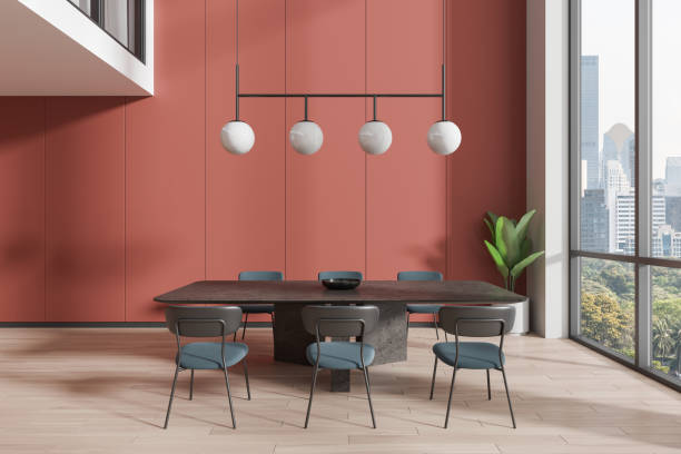 istock Modern dining room with red walls and large windows. 3D Rendering 2166280054