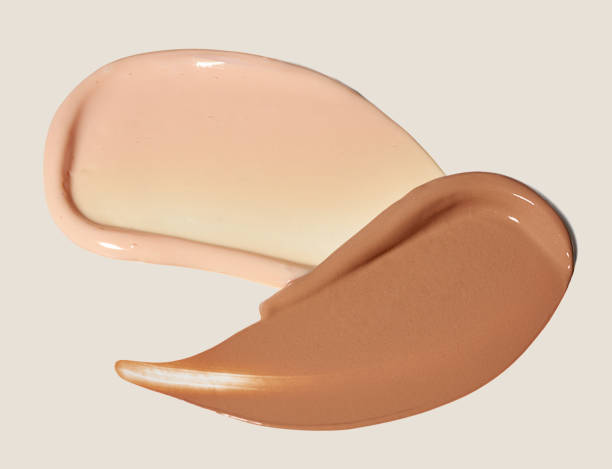istock Cosmetic smear bb cream, foundation texture on creamy beige background 2166282079