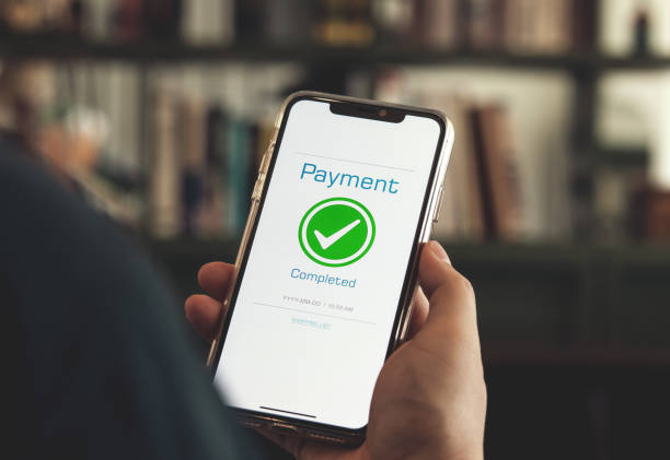 istock Customer using online banking application on smartphone to pay for purchases online and product in department store 2166282984