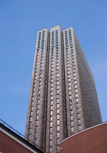 istock A tall building with a cloudy sky in the background 2166284330