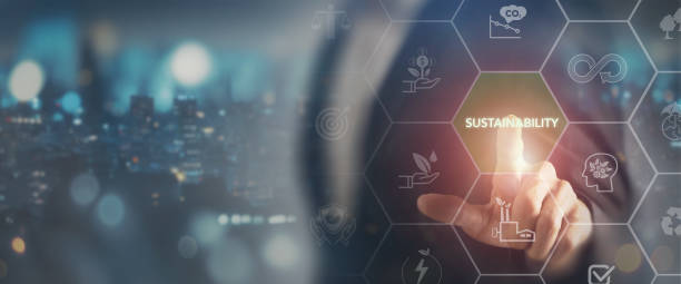 istock A futuristic digital interface focused on sustainability, with a person touching a virtual screen. Virtual icons highlight eco-friendly practices and green technology, environmental responsibility. 2166286250