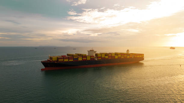 istock Cargo container ship carrying container and running in international container port customs shipyard sea port concept smart logistic service. Container Ship. 2166291230