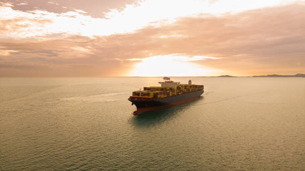 istock Cargo container ship carrying container and running in international container port customs shipyard sea port concept smart logistic service. Container Ship. 2166291234
