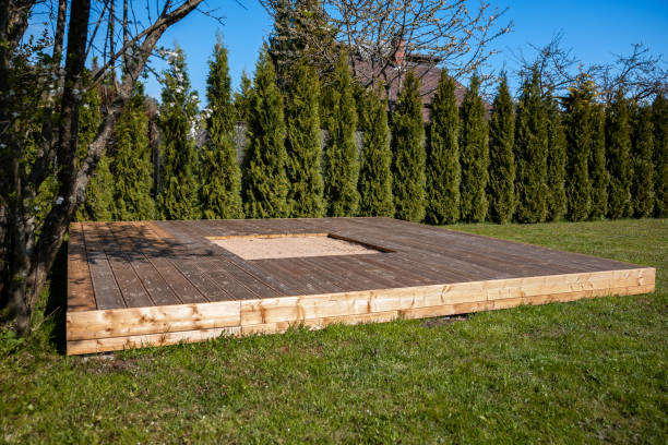 istock Wooden deck with a central sandpit in a sunny backyard, featuring a clean and simple design 2166294329
