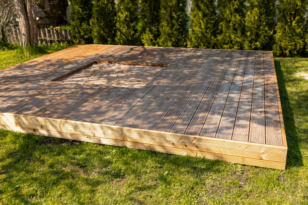 istock Wooden deck with central sandpit in a backyard setting, surrounded by trees and natural surroundings 2166294378