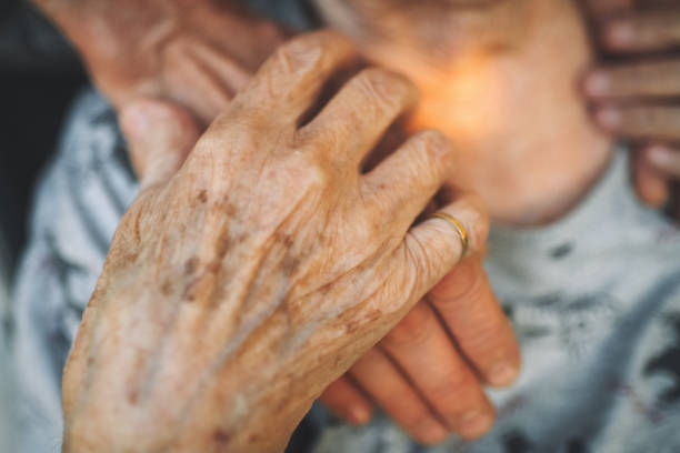 istock Close up of an elderly woman's hands 2166296293