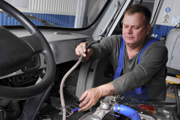 istock Mechanic Repairing Engine Components in Workshop During Daytime 2166299407