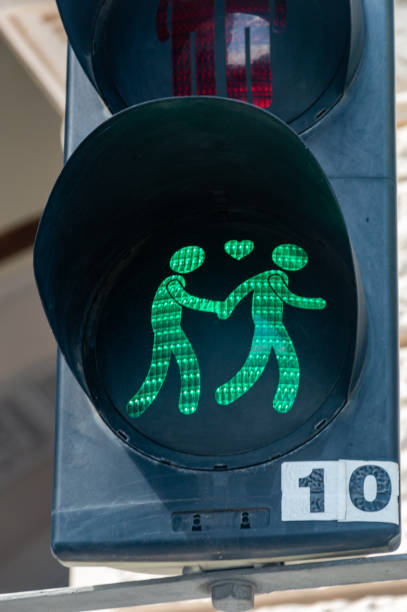 Vienna, Austria - June 8, 2024: Green light for pedestrian during Vienna Pride.