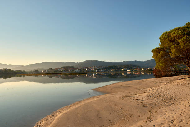 istock Dawn Breaks Over the Beautiful Playa de la Ladeira, Baiona 2166304002