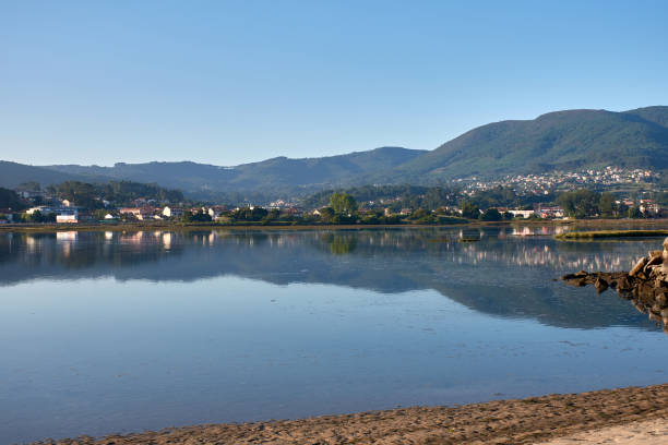 istock Dawn Breaks Over the Beautiful Playa de la Ladeira, Baiona 2166304004