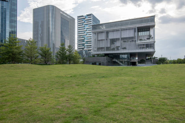 Contemporary urban architecture and green grasslands
