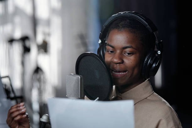 istock Singing African American Man in Professional Recording Studio 2166312058