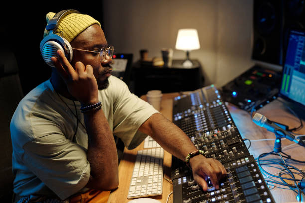 istock Mixing Audio on Soundboard in Studio Environment 2166312080