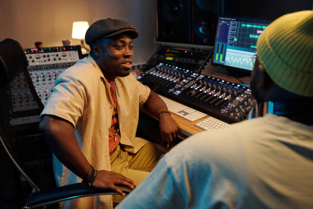 istock Collaborating in Professional Music Recording Studio 2166312089