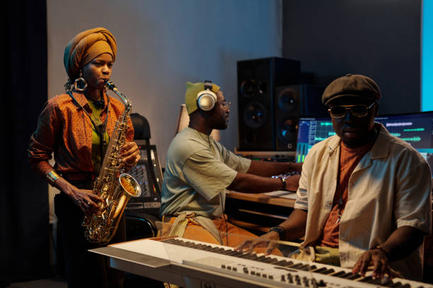 istock Creating Music in Recording Studio with Saxophone and Keyboard 2166312097