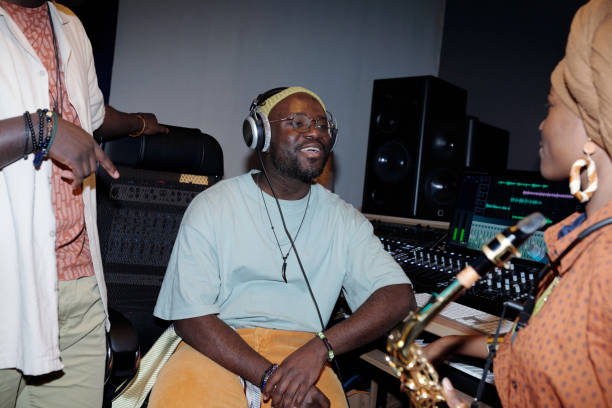 istock Smiling Man with Headphones in Recording Studio 2166312108