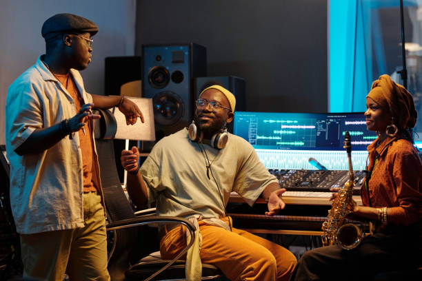 istock Collaborating in Music Studio with Audio Equipment 2166312115