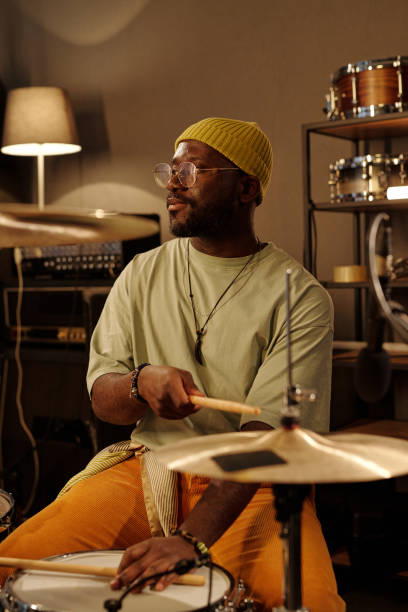 istock Playing Drums in Cozy Indoor Music Studio Setting 2166312130
