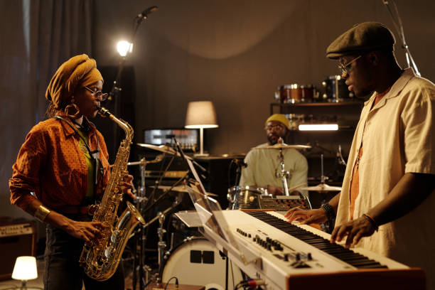 istock Musicians Rehearsing in Cozy Studio Environment 2166312133