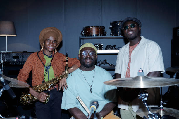 istock African American Musicians Posing With Musical Instruments Smiling 2166312149