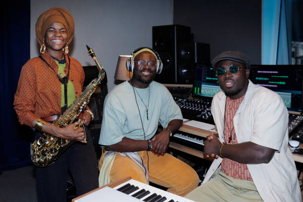 istock Collaborating Musicians in Recording Studio with Equipment 2166312150