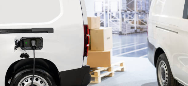 istock Electric delivery van with connected charging cable 2166315004