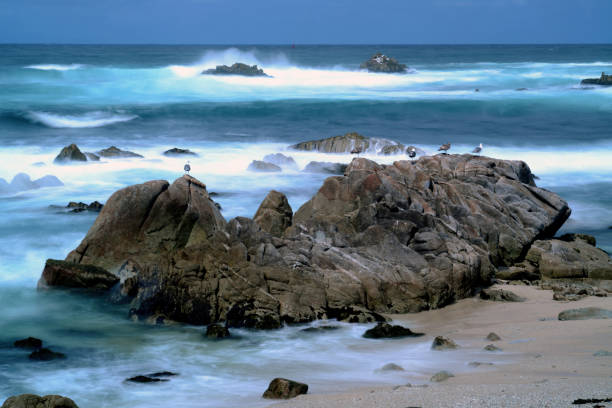 Carmel-by-the-Sea is a small beach city on California's Monterey Peninsula. It's known for the museums and library of the historic Carmel Mission, and the fairytale cottages and galleries of its village-like center. The Scenic Bluff Path runs from surf spot Carmel Beach to bird-rich Carmel River State Beach, with a scuba entry point.\n\nAfternoon at Carmel Beach, Carmel-by-the-Sea, California