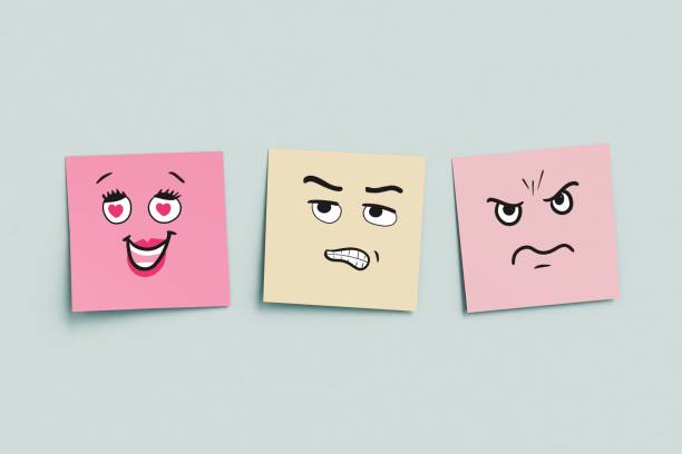 colorful sticky notes with different moods drawn on them stock photo.