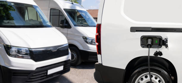 istock Electric delivery van with connected charging cable 2166316160