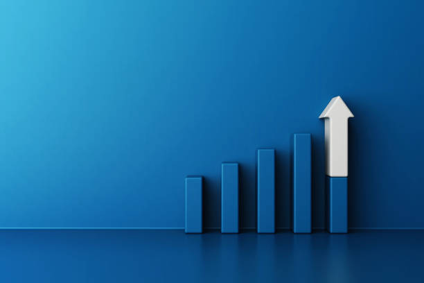 istock Bar graph in shades of blue rise sequentially from left to right, with the final bar featuring prominent white upward pointing arrow, conveys progress and achievement, 3d rendering 2166319094