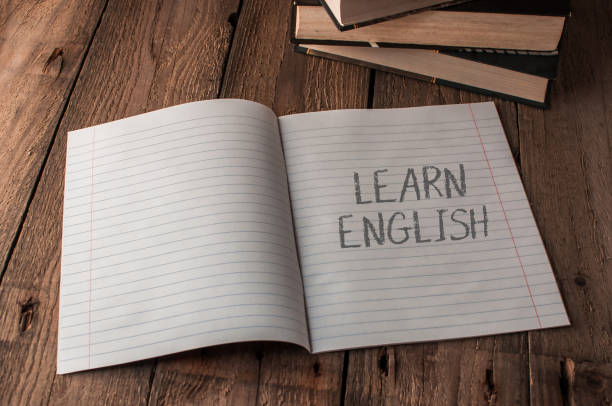 istock A notebook is open to a page with the word learn english written on it 2166323688