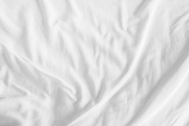 istock Abstract White Bedding Sheets or White wrinkled fabric background texture and Texture with copy-space :Creased or wrinkled white fabric,Soft focus 2166327037