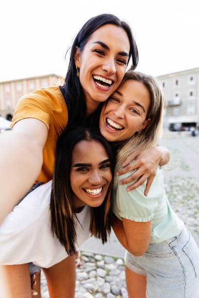 istock Three multiracial young women taking selfie portrait during summer vacation 2166328114