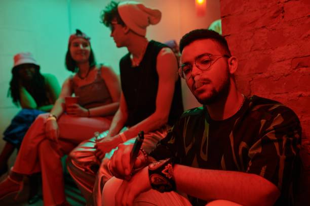 istock Young multiethnic man vaping in club 2166328483
